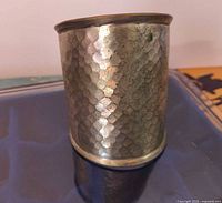 Front view of wide hammered silver-tone cuff bracelet