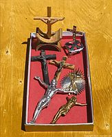 Overview showing all seven crucifixes in box