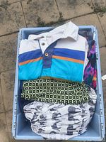 Bin with striped rugby shirt, patterned garments underneath