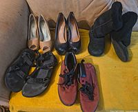 All five pairs of women’s shoes displayed together