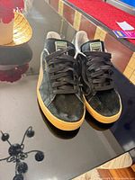 Side view of both shoes showing overall condition and gum sole