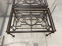 Top view showing ornate scrollwork and central circle
