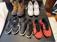 All five pairs of women’s shoes laid out on table