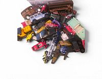 Pile of assorted die-cast vehicles showing variety and quantity
