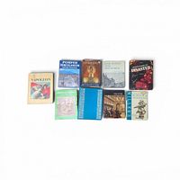 All eight books laid out showing front covers