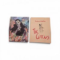 Front view of both items: Toulouse-Lautrec folio cover and Wasserberger sad clown print