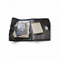Interior view of portfolio with stack of prints and matted piece