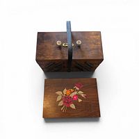 Closed wooden accordion sewing box with detached floral inlaid lid in front