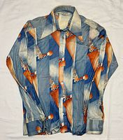 Front view of geometric long sleeve shirt laid flat