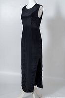 Front view of sleeveless black Viyella dress showing overall shape and side slit