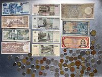 Group shot of all banknotes and coins laid out