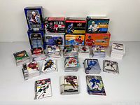 Overall view of seven Upper Deck hockey card boxes and numerous stacks of loose cards