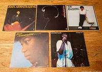 Group shot of all five LPs spread on floor showing front sleeve artwork