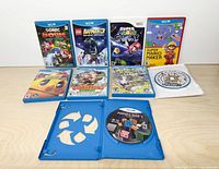 All nine game cases and discs arranged on table