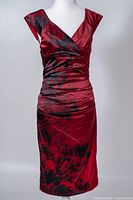 Front view of burgundy ruched midi dress on mannequin