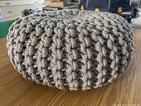 Side view showing chunky knit texture and overall shape