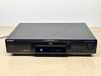 Front view of Sony DVP-S330 player showing tray, display and branding