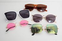 Group shot of all five sunglasses in lot