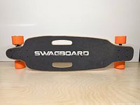 Top view showing grip tape logo and overall deck condition