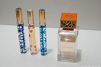 Front view of three rollerballs and 100ml bottle