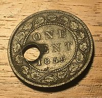 Reverse showing ONE CENT 1859 and maple leaf wreath around rim, visible hole