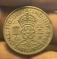 Reverse side showing crowned Tudor rose, thistle, shamrock, denomination and 1948 date