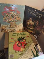 Front view of three Christmas tray puzzles