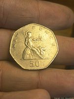 Reverse showing seated Britannia, denomination, and New Pence legend