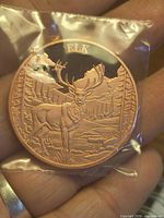Obverse showing Elk design in protective plastic