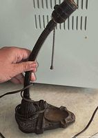 Side view showing entire lamp, gooseneck and base
