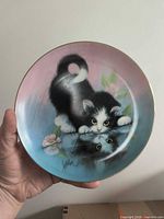 Front view of kitten collector plate showing artwork and gold rim