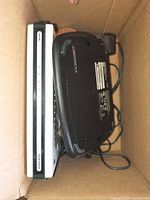 Top view of modem and router stacked in box