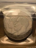 Obverse of coin showing dual portraits and inscriptions