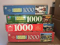 Stacked puzzle boxes showing all four titles and brands