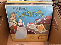 Front cover Walt Disney Cinderella LP with surrounding albums in box