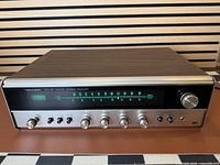 Front three-quarter view showing full unit, dial, knobs and cabinet