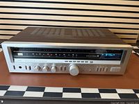 Front angled view of Sansui 4900Z receiver showing woodgrain cabinet and controls