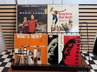 Front view of all four LP jackets in rack