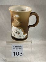 Front view showing cat illustration and overall mug shape