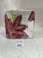 Front view of square majolica dish with floral design