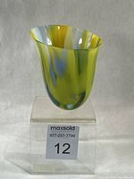 Front view of asymmetrical marbled glass vase