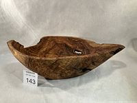 Top/side view of entire yellow cedar bowl showing freeform shape and grain