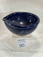 Oblique view showing overall form, glaze, and spout