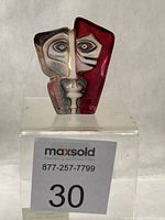 Front view of Mats Jonasson MASQ Domino sculpture showing abstract face and coloration