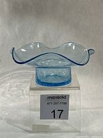 Full view of ice blue crackle glass bowl on stand