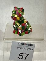 Front view of multicolour mosaic puppy figurine