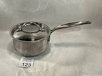 Side view of saucepan with lid showing overall condition