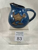 Front view of Sandy Richardson fish jug showing fish motif and bubble relief
