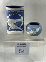 Front view of both Ecanada jasperware pieces showing designs and scale