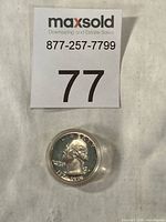 Coin in capsule with lot card